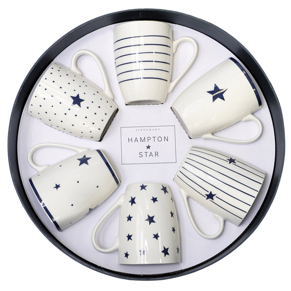 Set of six ceramic mugs with star and stripe patterns in a round black tin, branded 'Hampton Star'.