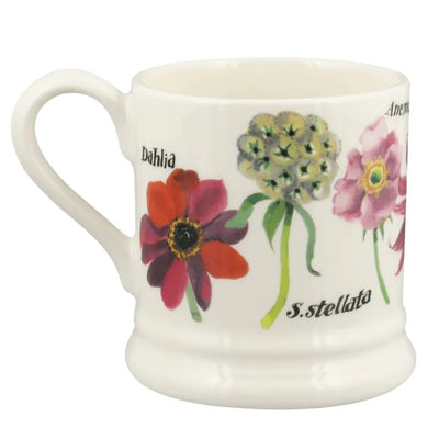White mug with floral designs and text on a white background