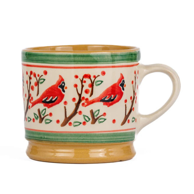 Ceramic mug with cardinal bird design on a white background