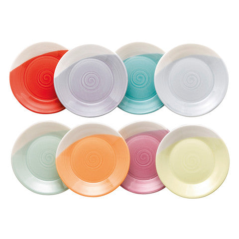 Set of colorful ceramic plates with spiral design on a white background